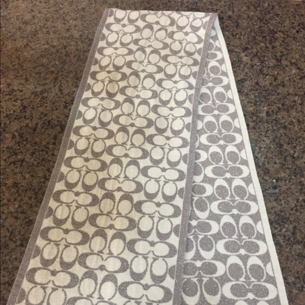 White and silver metallic Coach wool scarf.